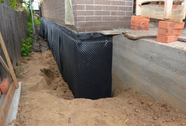 SJ Waterproofing Pros technician performing targeted Foundation Crack Repair assessment in Pittsford, NY